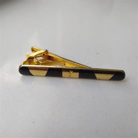 ysl tie clip.